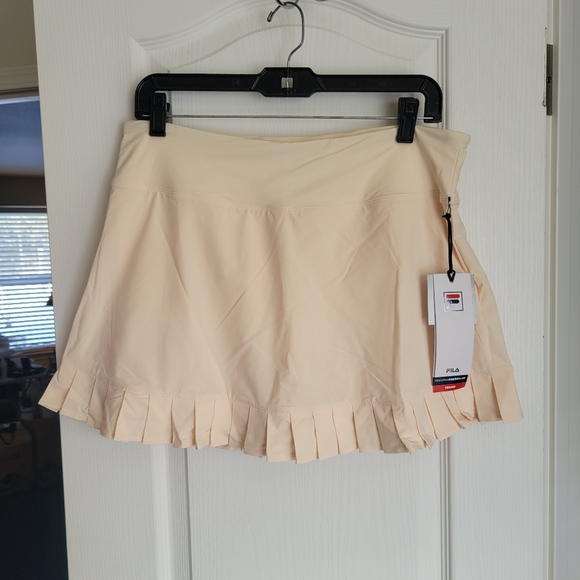 Fila Dresses & Skirts - Fila Beige Pleated Tennis Skort. NWT size Large.